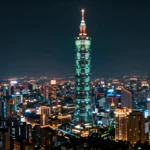 台北の夜景を空撮した構図に半導体回路パターンを重ねたコンセプトアート。